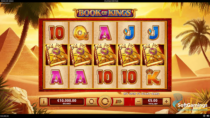 Book of Kings gameplay &mdash; libro dorado abri&eacute;ndose con animaci&oacute;n para revelar el s&iacute;mbolo expansivo aleatorio del bonus Pin Up Chile